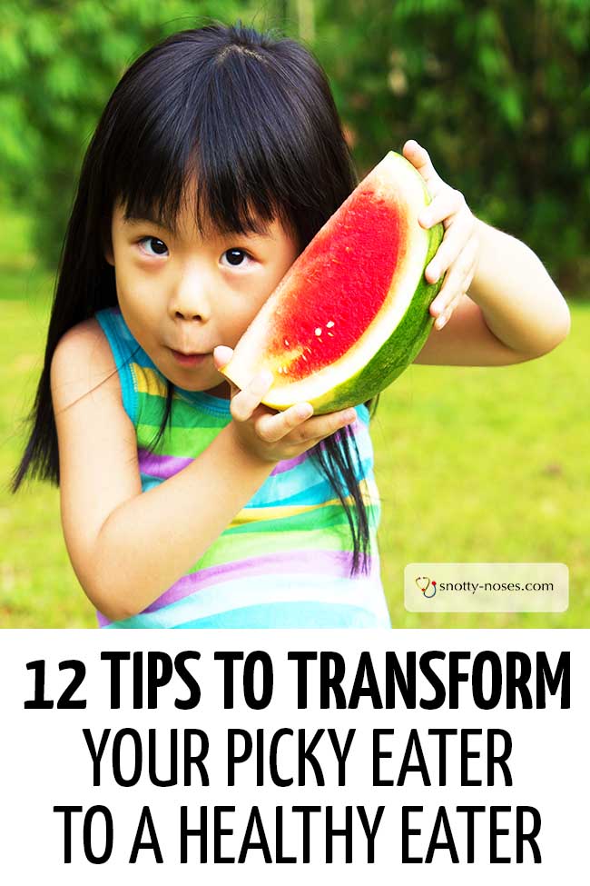 A little girl holding up a watermelon. #pickyeater #fussytoddler #fussyeaters #parents #parenthood #parentlife #lifewithkids