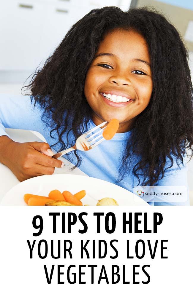 A girl smiling while eating baby carrots. #parenting #parents #parenthood #parentlife #toddlers #kids #pickyeater #fussytoddler #fussyeaters #parents #parenthood #parentlife #lifewithkids