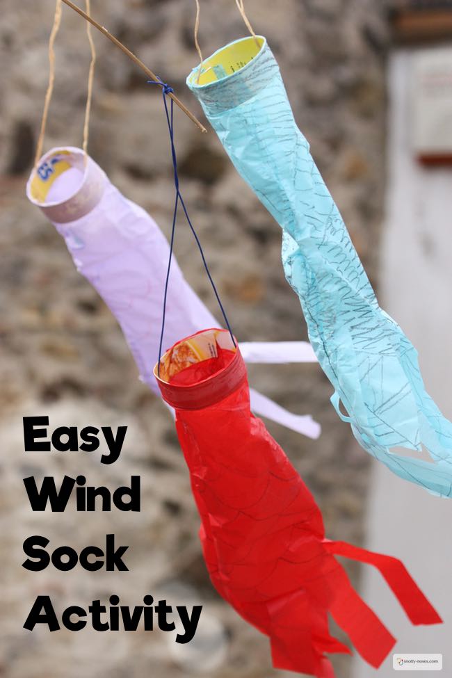 Easy Tissue Paper wind Sock Activity. My kids loved making these wind sock kites. They were super easy and super fun.