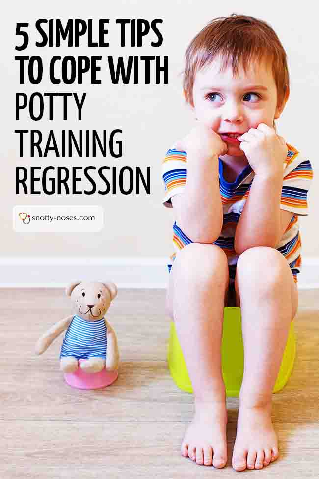 A little boy sitting on the potty and smiling. He doesn't look like he has a problem with potty training regression. #potttytraining #toilettraining #toddlers #parenting #parentlife #parentingtip